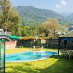Madhuban Resort Rooms (Hill View & Pool View Deluxe):  These premium rooms offer king-sized beds, exotic furniture, and breathtaking views of the mountains or pool.