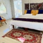 Deluxe Eco Room: Perfect for two, this room features organic wood interiors and a mountain-view balcony for a serene retreat.